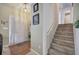 Welcoming entryway featuring hardwood floors, a staircase, and a view of the front door at 1047 Taso Trl, Acworth, GA 30101