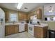 Well-maintained kitchen with wood cabinets and white appliances at 1047 Taso Trl, Acworth, GA 30101