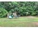 Community playground with slides and basketball court, providing recreational space for residents at 1047 Taso Trl, Acworth, GA 30101