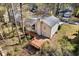 Aerial view of home with deck, and mature trees and shrubs at 1312 Brandl Dr, Marietta, GA 30008