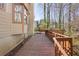 Side view of a spacious wood deck with an attached house and overlooks a wooded area at 1312 Brandl Dr, Marietta, GA 30008