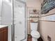 Cozy bathroom featuring a standing shower and shelving unit above the toilet at 1312 Brandl Dr, Marietta, GA 30008