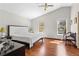 Bedroom featuring wood floors, vaulted ceiling, and two large windows at 1312 Brandl Dr, Marietta, GA 30008