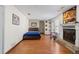 Bedroom with wood floors featuring a bed, fireplace, and a dedicated workspace by the window at 1312 Brandl Dr, Marietta, GA 30008