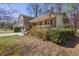 Angled view of a two-story home with attached two-car garage and covered front porch at 1312 Brandl Dr, Marietta, GA 30008
