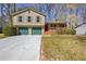 Charming two-story home with attached two-car garage and covered porch entrance at 1312 Brandl Dr, Marietta, GA 30008