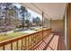 View from the covered front porch showing the lawn, landscaping, and neighborhood at 1312 Brandl Dr, Marietta, GA 30008