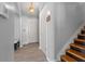 Neutral hallway with wood-look tile flooring, a staircase, and white doors at 1312 Brandl Dr, Marietta, GA 30008
