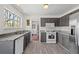 Kitchen with stainless steel appliances, granite countertops, and tile floors at 1312 Brandl Dr, Marietta, GA 30008