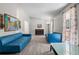 Open living room featuring stylish blue sofas, wood-look flooring, a piano, and ample natural light at 1312 Brandl Dr, Marietta, GA 30008