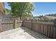 Cozy back patio area enclosed by a privacy fence, perfect for relaxing and outdoor activities at 223 Glens Loop, Woodstock, GA 30188
