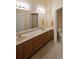 Bathroom featuring dual sinks, tile floors, and plenty of counter space at 223 Glens Loop, Woodstock, GA 30188