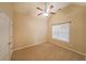 Bright bedroom with large window and ceiling fan for comfort and ample natural light at 223 Glens Loop, Woodstock, GA 30188