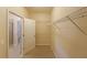 Walk-in closet with ample shelving at 223 Glens Loop, Woodstock, GA 30188