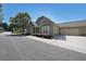 Charming home featuring neutral siding, a well-manicured lawn, and an attached two-car garage on a sunny day at 223 Glens Loop, Woodstock, GA 30188