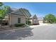 Well-maintained home featuring neutral siding, manicured landscaping, and an attached two-car garage at 223 Glens Loop, Woodstock, GA 30188