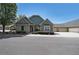 Inviting one-story home with brick and siding, complemented by a manicured lawn and charming curb appeal at 223 Glens Loop, Woodstock, GA 30188