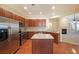 Well-equipped kitchen with stainless steel appliances, granite counters, a functional island, and ample storage space at 223 Glens Loop, Woodstock, GA 30188