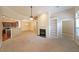 Bright living room featuring a fireplace, built-in shelves, and an open floor plan with views to kitchen and dining at 223 Glens Loop, Woodstock, GA 30188