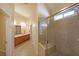Main bathroom offers dual sinks, tile floors, and large tiled shower at 223 Glens Loop, Woodstock, GA 30188