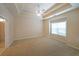 The main bedroom includes carpet flooring and trey ceilings at 223 Glens Loop, Woodstock, GA 30188