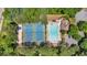 Aerial view of the community pool and tennis courts surrounded by mature trees at 2372 Oberon Se Walk, Smyrna, GA 30080
