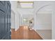 Bright foyer with gleaming hardwood floors, soaring ceilings, and an open staircase create an inviting entrance at 2372 Oberon Se Walk, Smyrna, GA 30080