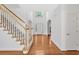 Inviting foyer with hardwood floors and staircase, leading to the upper levels of the home at 2372 Oberon Se Walk, Smyrna, GA 30080
