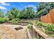 Expansive garden area with curved raised beds and a mix of stone and gravel pathways at 2372 Oberon Se Walk, Smyrna, GA 30080