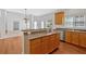 Functional kitchen with light wood cabinets, solid surface countertops, and open layout to the living area at 2372 Oberon Se Walk, Smyrna, GA 30080