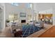 Open-concept living room with fireplace, high ceilings, and natural light, ideal for relaxation and entertaining at 2372 Oberon Se Walk, Smyrna, GA 30080