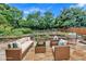 Back patio featuring comfortable outdoor furniture and a gas grill at 2372 Oberon Se Walk, Smyrna, GA 30080