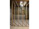 Unfinished basement area featuring exposed framing and insulation against a concrete foundation at 4220 Glad Morning Dr, College Park, GA 30349