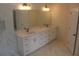 Elegant bathroom boasts double vanity with marble countertop and modern fixtures at 4220 Glad Morning Dr, College Park, GA 30349