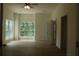 Spacious bedroom with large windows offering ample natural light and wood-look flooring at 4220 Glad Morning Dr, College Park, GA 30349