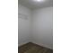 Unfinished closet with wood-look flooring and wire shelving at 4220 Glad Morning Dr, College Park, GA 30349