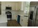 Bright kitchen featuring stainless steel appliances, granite countertops and a subway tile backsplash at 4220 Glad Morning Dr, College Park, GA 30349