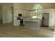 Bright kitchen with stainless steel appliances, ample cabinetry, and a central island for cooking at 4220 Glad Morning Dr, College Park, GA 30349