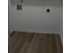 Unfinished laundry room area with connections and wood-look flooring at 4220 Glad Morning Dr, College Park, GA 30349