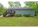 Exterior of home showing a deck, backyard, and well maintained lawn at 476 Cody Ln, Douglasville, GA 30134