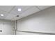 Unfinished basement with concrete walls, exposed ceiling, utility connections, and fluorescent lighting at 476 Cody Ln, Douglasville, GA 30134