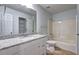 Clean bathroom with tiled floor, granite countertop, white cabinets, updated fixtures, and shower/tub combo at 476 Cody Ln, Douglasville, GA 30134