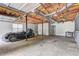 Large garage with exposed ceiling, unfinished walls, and ample space for storage or workshop at 476 Cody Ln, Douglasville, GA 30134