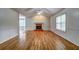 Bright living room with hardwood floors, fireplace, and wainscoting at 476 Cody Ln, Douglasville, GA 30134