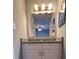 Bathroom with a vanity, granite countertop, a large mirror, and modern lighting fixtures at 5389 Martins Crossing Rd, Stone Mountain, GA 30088