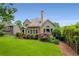 Expansive backyard featuring a lush lawn, mature landscaping, and a deck perfect for outdoor enjoyment at 2026 Cresthaven Walk, Woodstock, GA 30189