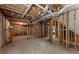 Unfinished basement with exposed ductwork, wooden framing, and concrete flooring at 2026 Cresthaven Walk, Woodstock, GA 30189