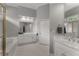 Bathroom featuring double sinks, white cabinets, and lots of natural light at 2026 Cresthaven Walk, Woodstock, GA 30189