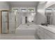 Bright bathroom featuring a soaking tub, glass shower, and double vanity at 2026 Cresthaven Walk, Woodstock, GA 30189