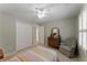Comfortable bedroom with carpet, dresser, and double door closet at 2026 Cresthaven Walk, Woodstock, GA 30189